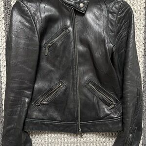 Black Leather Jacket with Zipper Details
